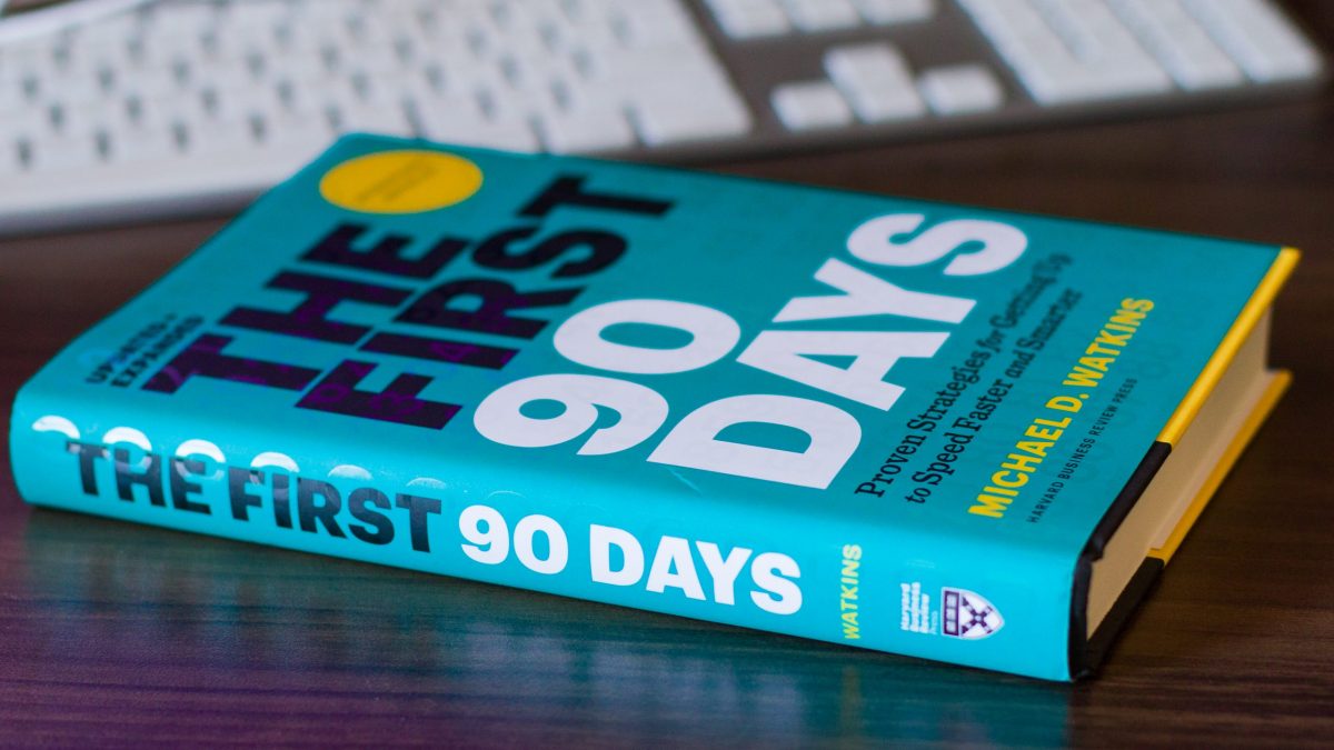 The First 90 Days book cover on desk